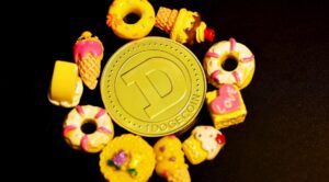 dogecoin token surrounded by sweets, including donuts