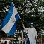 A man waving the El Salvador flag; Photo: Pexels